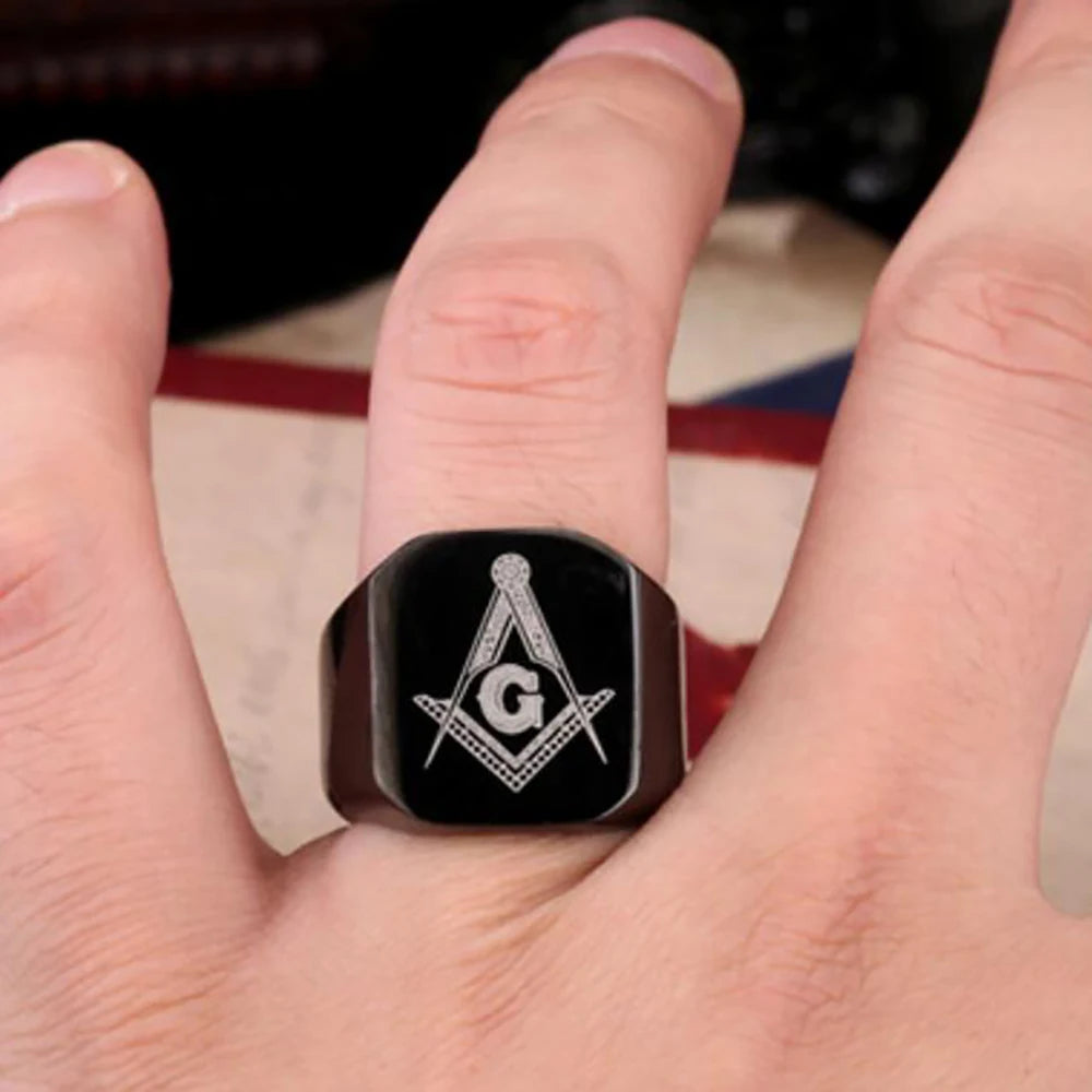 Black cushion Masonic signet worn on a finger