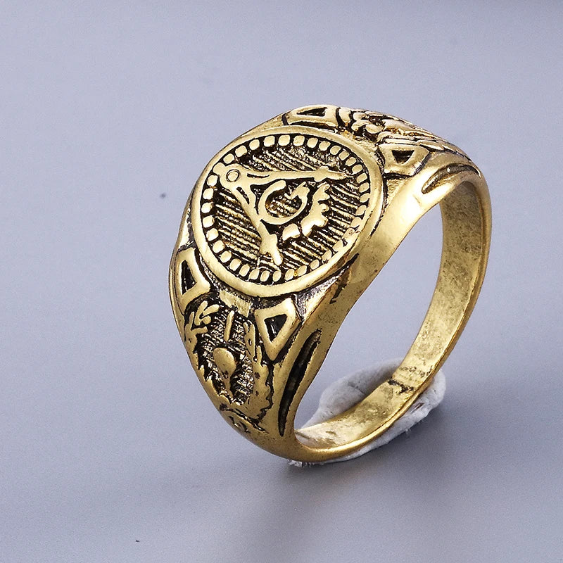 Antiqued gold-tone oval Masonic ring with raised shoulder ornament