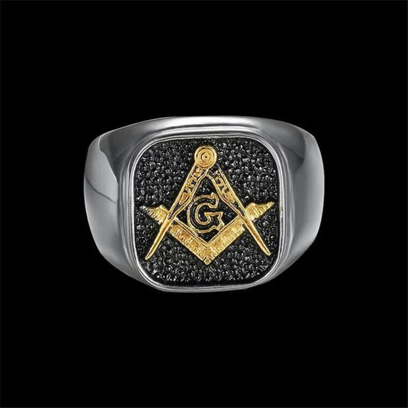 Front of two-tone Masonic ring with black square face and gold-tone emblem