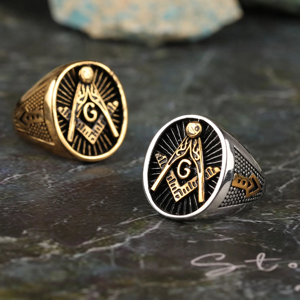 Gold-tone and silver-tone Masonic rings with black sunburst faces