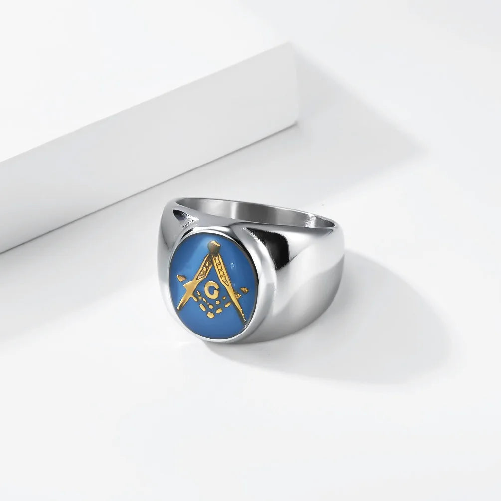 Silver-tone blue Masonic ring with gold-tone emblem on white steps