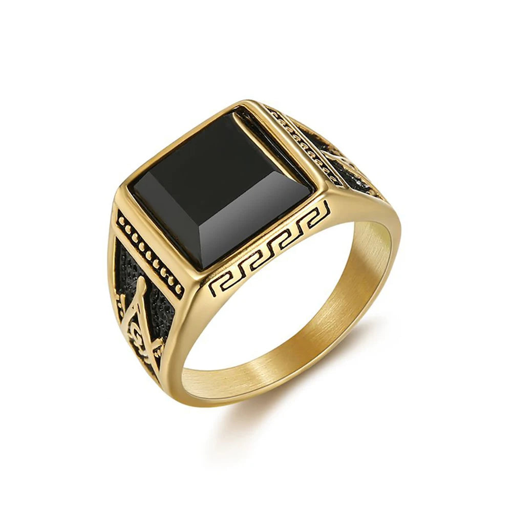 Gold-tone Masonic ring with rectangular black stone and Greek-key border