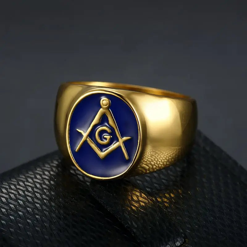 Gold-tone oval blue Masonic ring angled on dark display