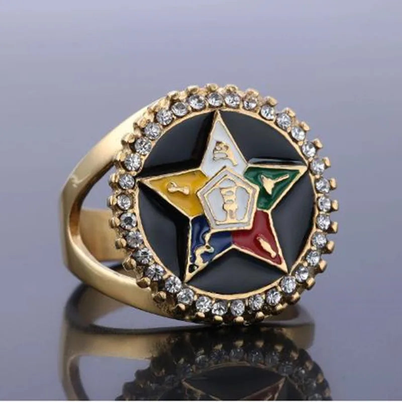Gold-tone Eastern Star ring with black oval face and clear-stone halo